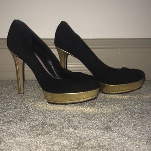 Black and gold Vince Camuto heels.